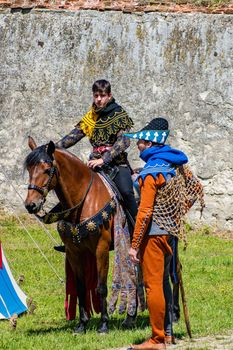 Knight on horseback with his squire