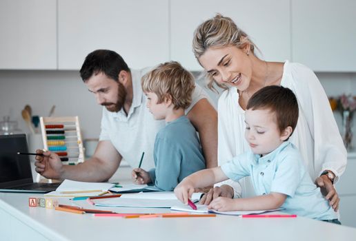 Young caucasian family homeschooling their two children. Loving parents helping their little children with homework. Mom and dad teaching kids to write, read and draw