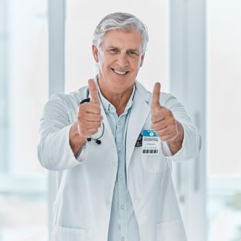 The doc will take care of you. Portrait of a mature doctor showing thumbs up in a hospital.