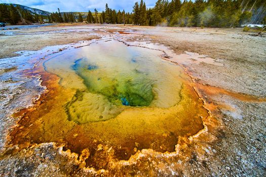 Yellowstone hot spring with warm and cool colors