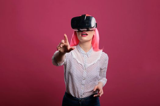 Young woman using vr glasses with augmented reality tech