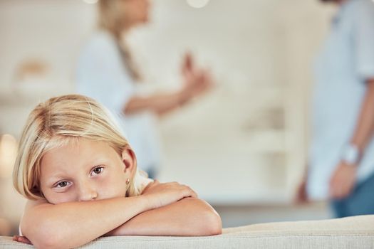 Portrait of sad little girl, parents fighting in the background. Depressed child, parents arguing at home. Couple in conflict around their daughter. Stressed caucasian girl parents divorcing
