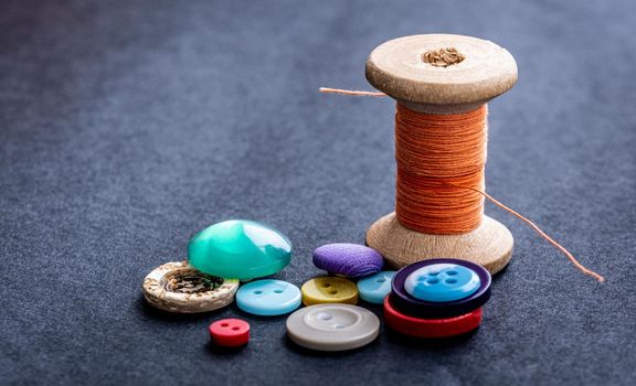 Sewing buttons and thread spool