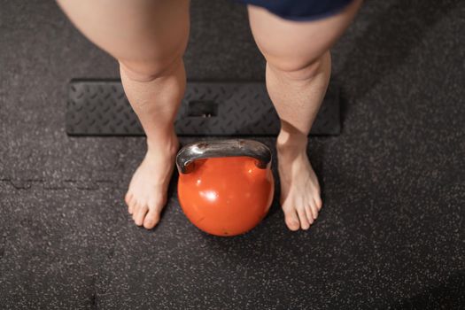 A kettlebell on the ground at the local training and fitness center