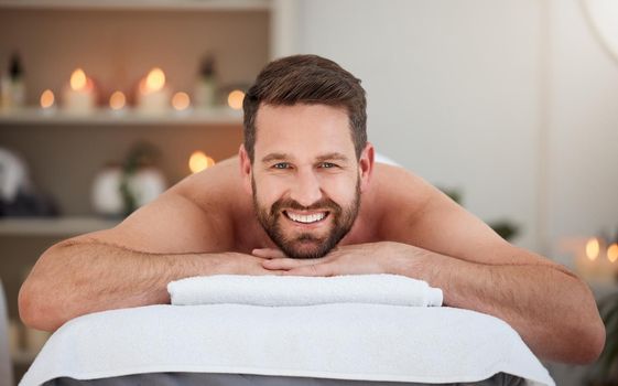 Happiness is massage day. a male relaxing on a bed in a spa.