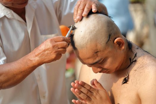 Male who will be monk shaving hair for be Ordained