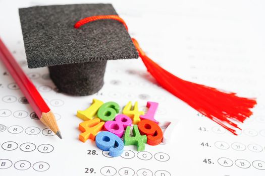 Math number with graduation gap hat on answer sheet test choice for learning Mathematic, education math concept.