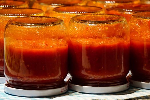 Homemade tomato sauce in the jars traditional prep for the winter months
