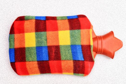 Hot water bottle thermophore on isolated background