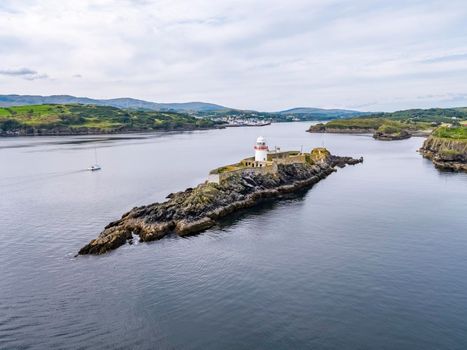 Aerial of the Rotten Island Lighthouse with Killybegs in background - County Donegal - Ireland
