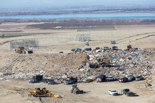 NAMPA, IDAHO - MARCH 27, 2021:Trucks dumping their waste at the county landfill