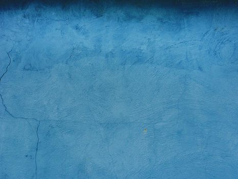 Abstract blue texture background. Surface of old damaged blue plaster.
