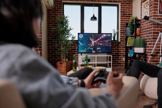 Multiethnic group of people playing online video games on tv console