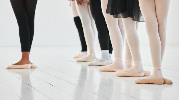 Every ballerina was once a beginner. a group of unrecognisable ballet dancers practicing their routine in a dance studio.