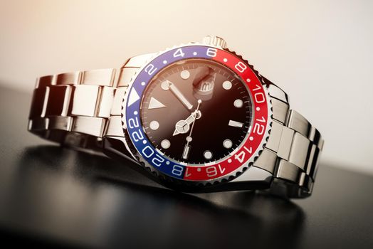 formal luxury men wristwatch with blue-red bezel