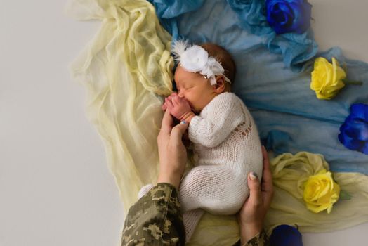Concept patriotic Ukrainian shooting of a newborn