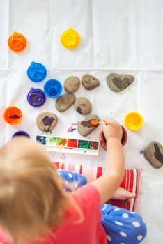 toddler paints with gouache