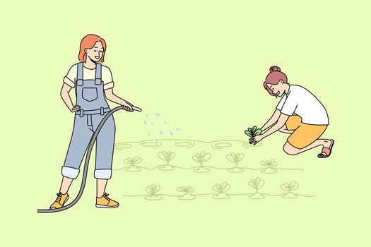 Women working in garden together