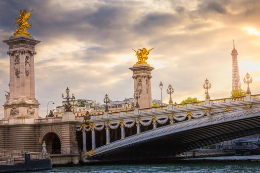 Eiffel Tower and Pont Alexandre III at dramatic sunset, Paris, france