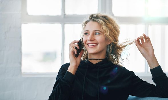 Beautiful woman using smartphone having phone call smiling enjoying conversation at home