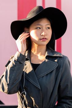 vertical portrait of a young classy asian woman