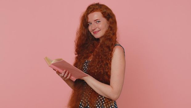 Redhead woman reading funny interesting fairytale story book, leisure hobby, education, learning