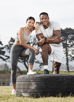 Well reach our fitness goals by motivating each other. an athletic man and woman standing together outside.