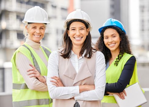 Were the job. Cropped portrait of three attractive female engineers standing with their arms folded on a construction site.