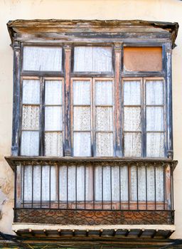 Old wooden balcony modernist style in Cartagena city, Murcia, Spain