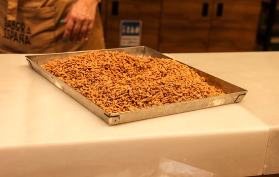 Caramelized pine nuts on a tray in Spain