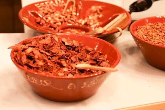 Dehydrated and caramelized coconut flakes in a bowl