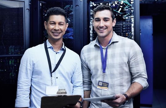Need a network upgrade Were your guys. two young men working together in a server room.