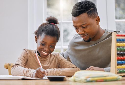 Homework doesnt have to be boring. a young father helping his daughter with homework at home.