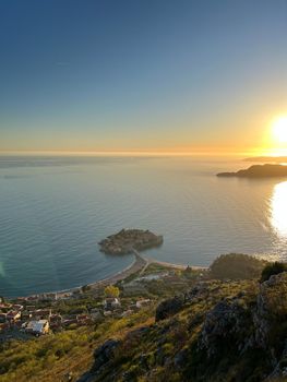 View from the mountain to the Sveti Stefan island at sunset. High quality photo