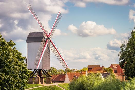 Rustic wooden windmills in idyllic Bruges public park, Belgium