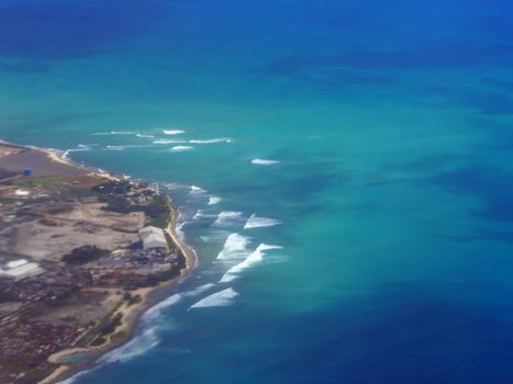 Aerial of Waves rolling towards Barbers Point on Oahu