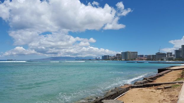 Beach in world famous tourist area Waikiki on a beautiful day