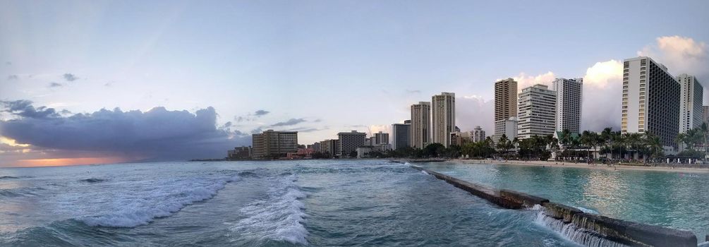 Panoramic of Waves rolling towards protected water of Waikiki beach