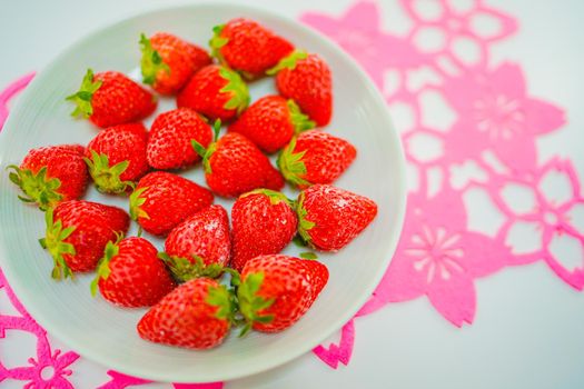 Frozen strawberries and white dishes