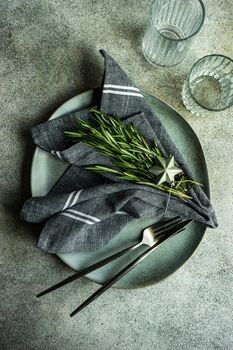 Table setting with fresh rosemary
