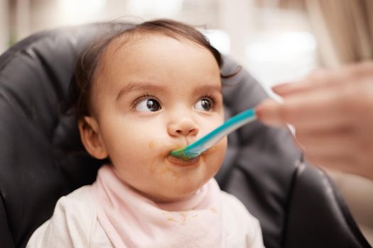 Did you taste this. an adorable baby girl eating her food.