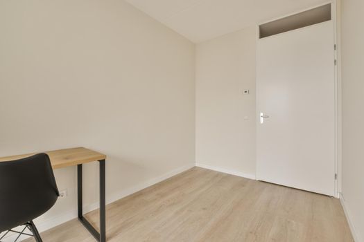 room with white walls and parquet floor