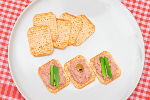 Crispy Salted Crackers with Liver Pate, Green Onions and Olives