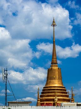The golden pagoda is located in the city, towering to the sky