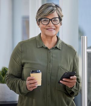 Always keep in touch with staff. a CEO enjoying a cup of coffee while using her smartphone.