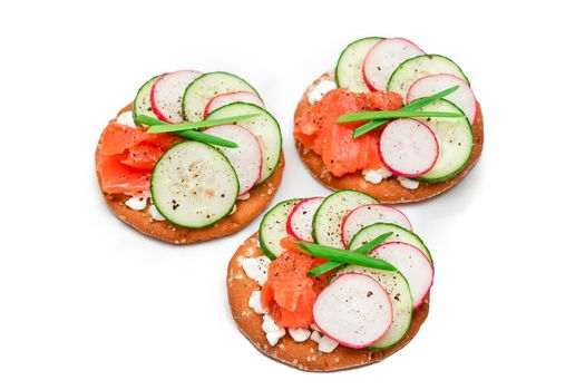 Cracker Sandwiches with Salmon, Cucumber, Radish, Cottage Cheese and Green Onions - Isolated