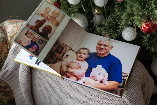 family photo book near the Christmas tree