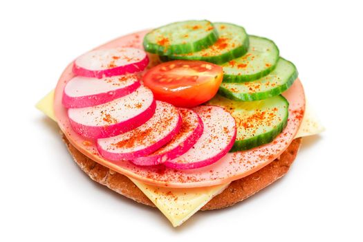 Cracker Sandwich with Fresh Cucumber, Cheese, Sausage, Radish and Tomato - Isolated