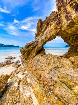 Koh Phayam beach Hin Talu with rock arch formation in Ranong, Thailand.