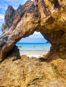 Koh Phayam beach Hin Talu with rock arch formation in Ranong, Thailand.